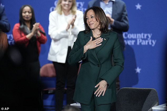 Vice President Democratic presidential candidate Kamala Harris gestures as she concludes a town hall at the Royal Oak Theater in Royal Oak, Michigan, Monday, Oct. 21, 2024.