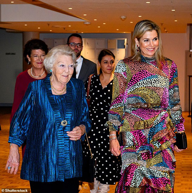 Máxima wore a multicolored midi dress from India-born, London-based brand Saloni, while her mother-in-law opted for a vibrant royal blue tunic made from bright yarn.