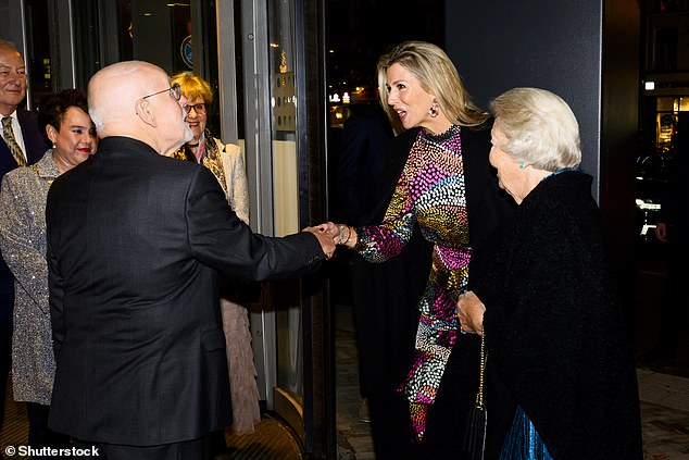 Máxima appeared especially cheerful as she greeted Ton Koopman (right), who the Dutch royal family was in Utrecht to celebrate.