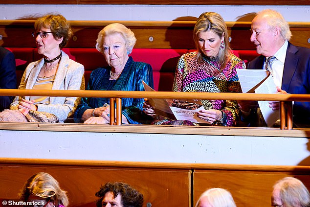 The Dutch royal, 53, seemed engrossed in the anniversary concert program.