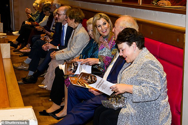 Máxima wore her long blonde hair in a classic updo for the event and illuminated her complexion with golden bronzer and a touch of berry lipstick.