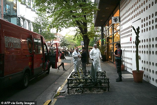 Forensic teams arrive at the Casa Sur Hotel in Buenos Aires to investigate on October 16