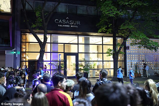 Fans watch emergency services work at the Hotel Casa Sur in Buenos Aires on October 16.