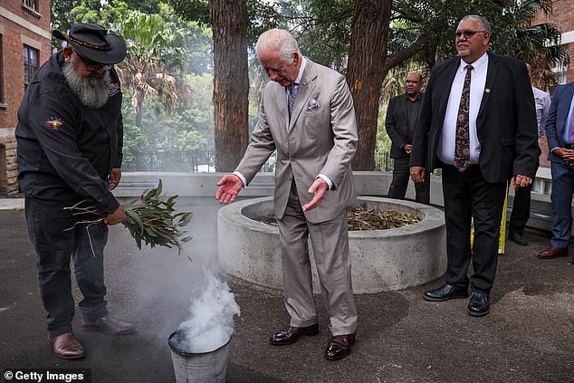 A traditional smoking ceremony took place when King Charles arrived at the center on Tuesday.