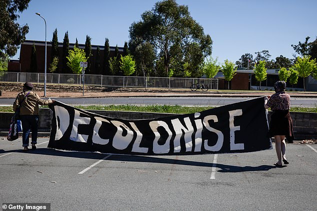 Some protesters unfurled a banner that said 