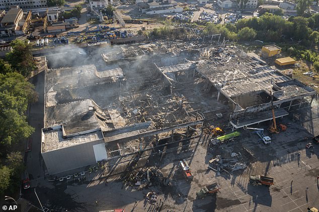 Smoke rises from the ruins of the Amstor shopping center in the central Ukrainian city of Kremenchuk after it was hit by long-range guided missiles in June 2022.