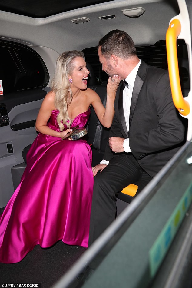 She was seen smiling at her boyfriend in the taxi as they left the event.