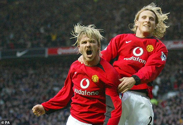 Forlán (right, pictured with David Beckham) helped Man United win the Premier League in 2003.