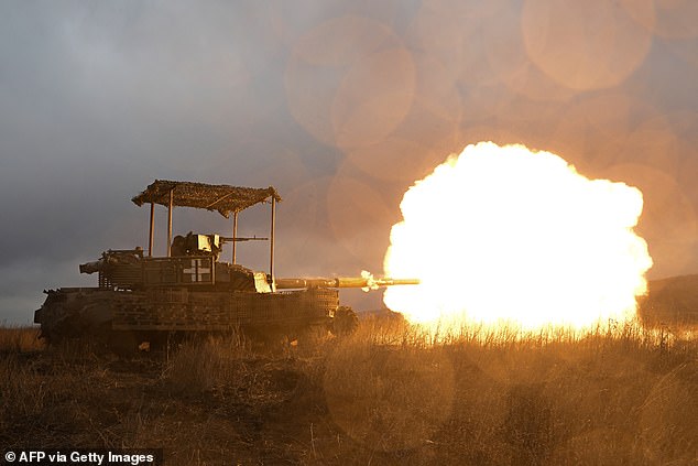 Ukrainian servicemen shoot with a tank while checking it after maintenance not far from Bakhmut, Donetsk region, February 5, 2024.