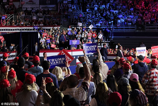 The building was sold out and some loyal followers of the former president were forced to remain standing.