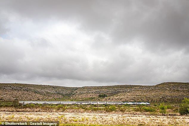 Sanderson receives nine train arrivals a week. In this image, the Amtrak Sunset Limited train travels through the desert near the small town.