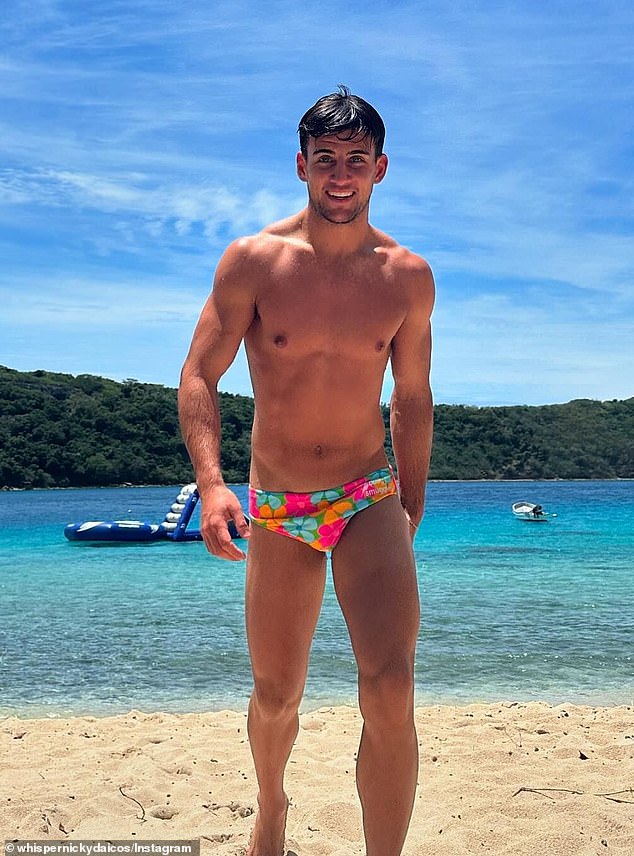 In a series of pictures, Nick can be seen enjoying the tropical weather while lounging by the beach. In a sizzling photo, the Collingwood midfielder showed off his ripped physique in a pair of skimpy, colorful swim trunks.