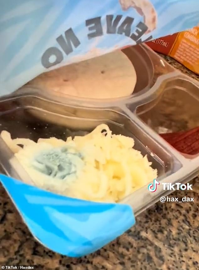 TikTokker opens package and finds what appears to be mold on grated cheese