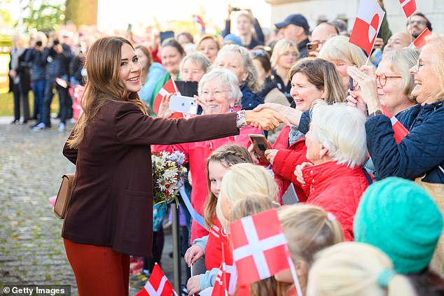 The 52-year-old royal greeted her fans by waving Danish flags upon her arrival.