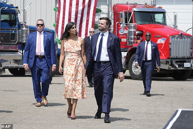 Vance walking with her husband before giving a speech at a campaign event in Byron Center, Michigan, on August 14.