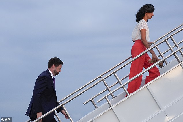 Usha Vance heads to a plane in front of her husband JD on August 7, 2024