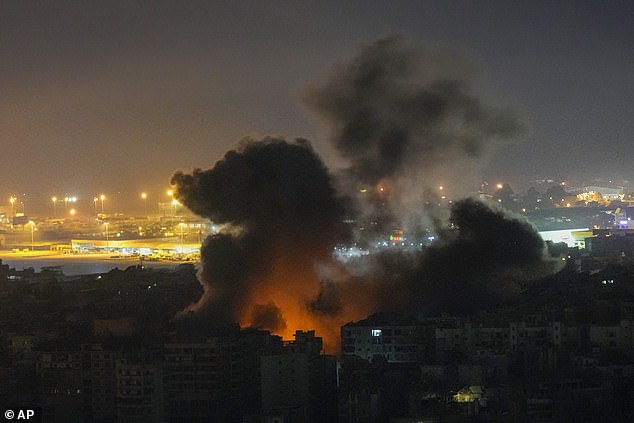 Flames and smoke rise into the sky after an Israeli airstrike in Dahiyeh, Beirut, Lebanon, today