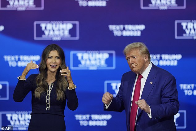 Donald Trump sways to music at town hall with Gov. Kristi Noem