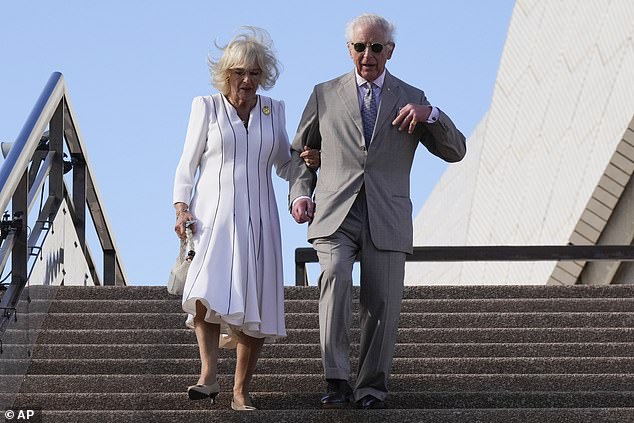 Earlier, Camilla grabbed the King's arm for support as the couple walked down the steps of the Sydney Opera House.