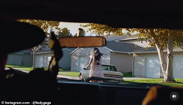 In a teaser clip from the point of view of an approaching vehicle, the actress and singer, whose real name is Stefani Germanotta, sported black hair as she fled from him.