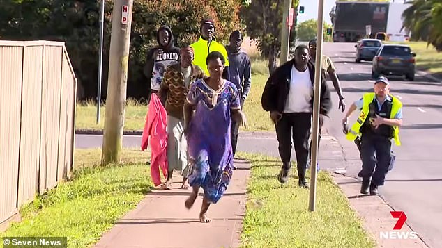 Devastated loved ones are seen rushing to the crash site on Tuesday