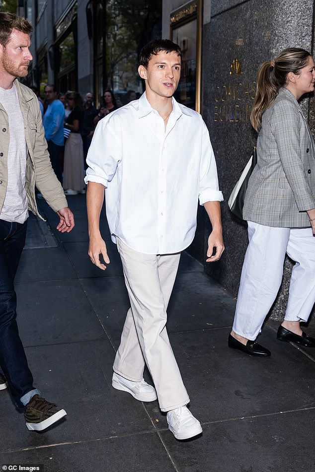 Tom looked stylish in beige Ami jeans, a white Ami shirt and Axel Arigato Clay sneakers as he arrived to appear on Jimmy Fallon's show.