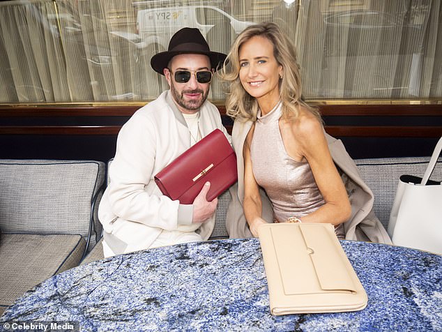 During the event, she was also joined by British fashion designer Scott Henshall, 48, and the pair smiled as they posed for several photos together.