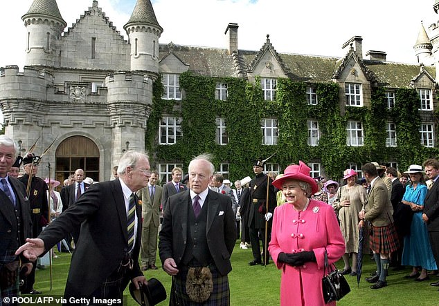 Queen Elizabeth is photographed at Balmoral Castle, believed to be her favorite royal residence, in 2002.