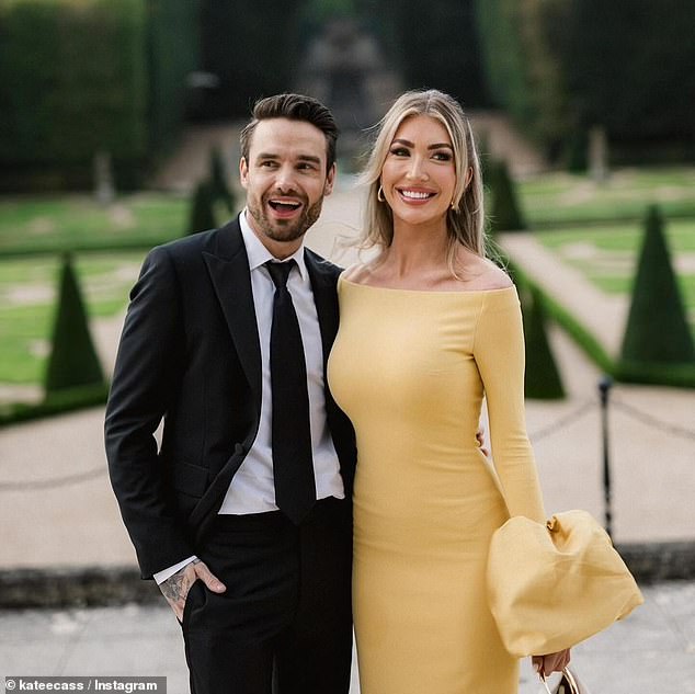 Another photo showed them posing and dressed to impress: she beaming in a yellow dress and him in a black tie.