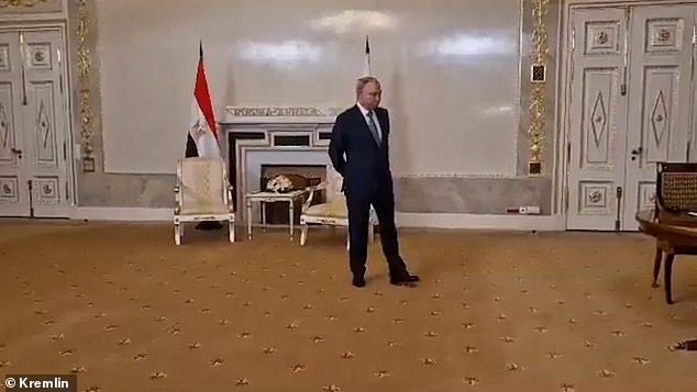 Putin was seen shuffling his feet as he waited for his Egyptian counterpart.