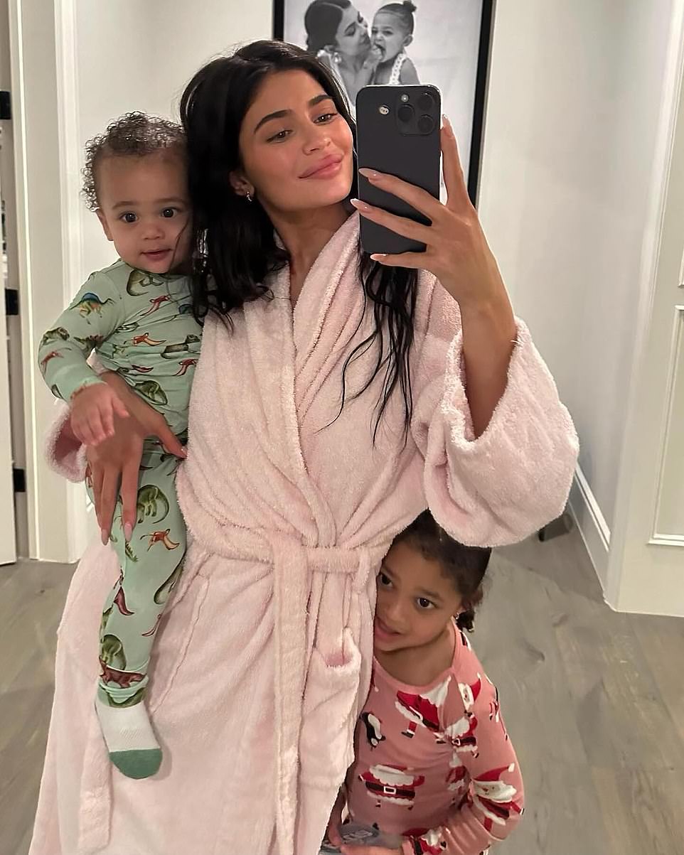 Jenner seen at her Hidden Hills, California mansion with her two children Stormi and Aire.