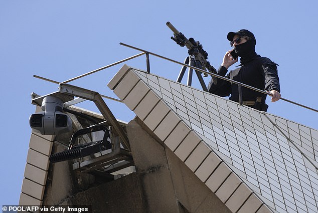 The shooters were dressed in black and had a scarf that covered half their faces. They also wore a black cap and sunglasses.