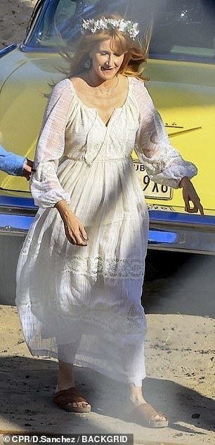 Laura looked sensational in her flower power look while filming