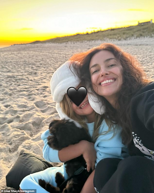 The seven-year-old blonde clearly adores her little canine companion, as seen in a rare snap the 38-year-old Russian bombshell posted on Oct. 13 from a Hamptons beach.