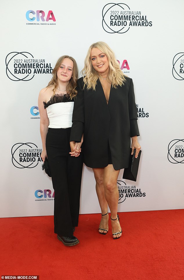 Jackie revealed that at the height of her addiction, she was consuming up to 12 Stilnox sleeping pills and 24 Panadeine Forte tablets a day, often with alcohol. Pictured at the 2022 Australian Commercial Radio Awards with his daughter Kitty shortly before leaving the country.