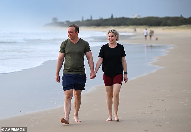 The Prime Minister enjoyed some downtime with wife Kim McDowell at Marcoola Beach on the Sunshine Coast on Thursday morning.