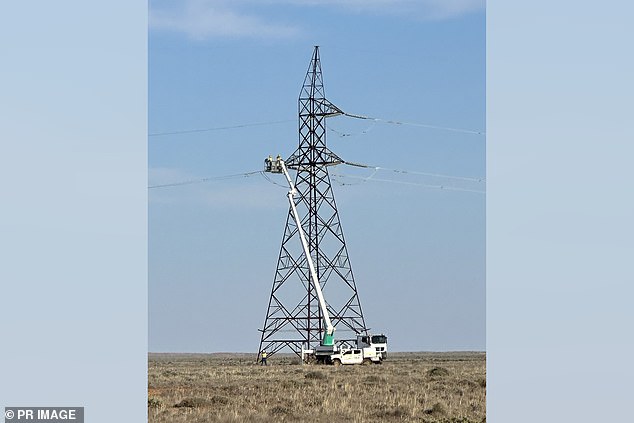 Workers are repairing the power grid after storms destroyed power lines. (Provided by Transgrid/AAP PHOTOS)