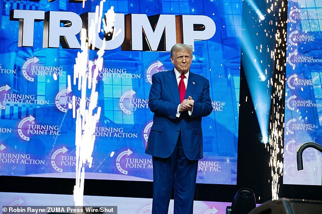 Trump, flanked by a fireworks display, addresses a massive crowd of supporters at the Gas South Arena on Wednesday.