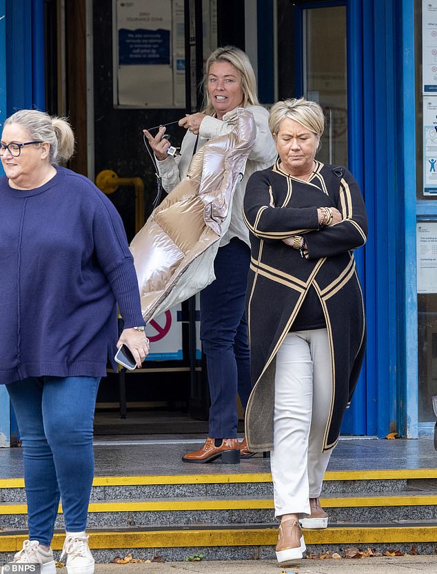 Nicola Hewitson, 56 (pictured centre), waited outside a Tesco supermarket before speeding up Michelle Jennings' £35,000 B-class model as she left the store pushing a trolley full of groceries.