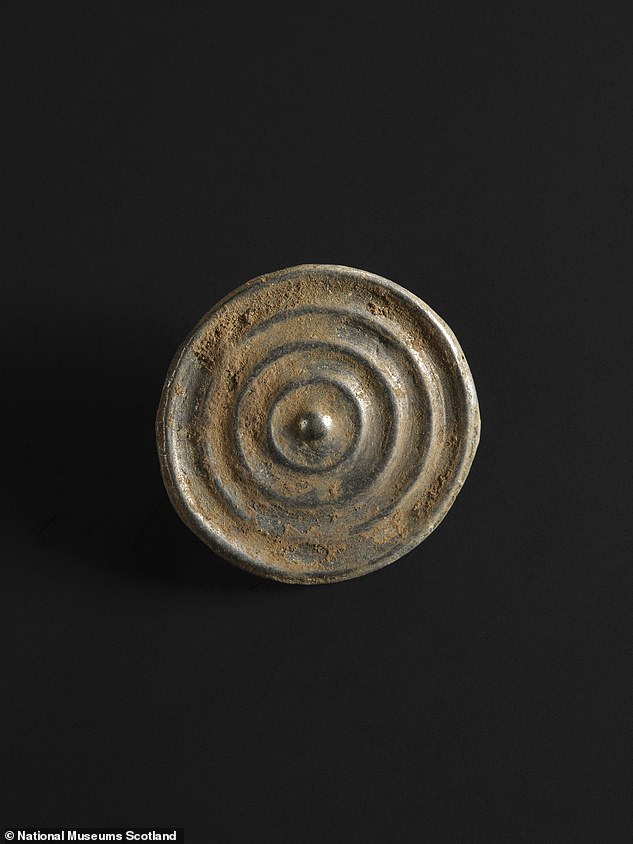 A bronze button from the Bronze Age Peebles hoard