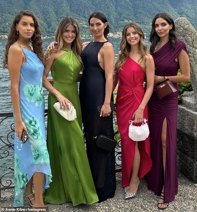 Annie (center) photographed with friends at the Italian wedding. She is currently in the process of divorcing the Manchester City and England star.