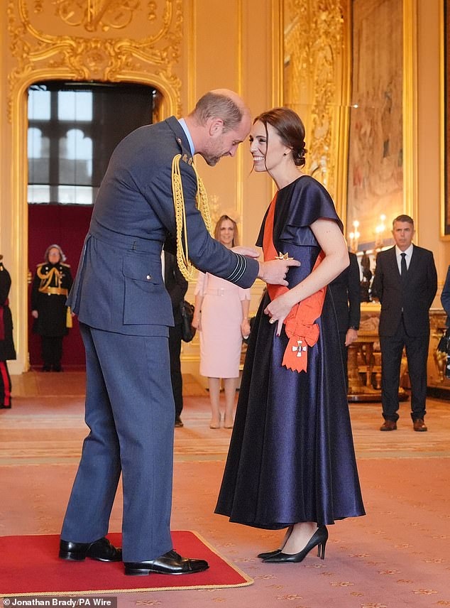 Ardern is made a Dame by the Prince of Wales during a ceremony at Windsor Castle.