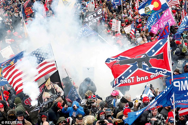 Tear gas is fired into a crowd of protesters during clashes with Capitol Police at a demonstration to challenge the certification of the 2020 election.