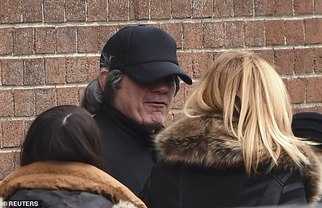 Gerry Hutch wears a costume as he leaves after attending the funeral of his brother Eddie Hutch, at Our Lady of Lourdes Church in Dublin, Ireland, on February 19, 2016.