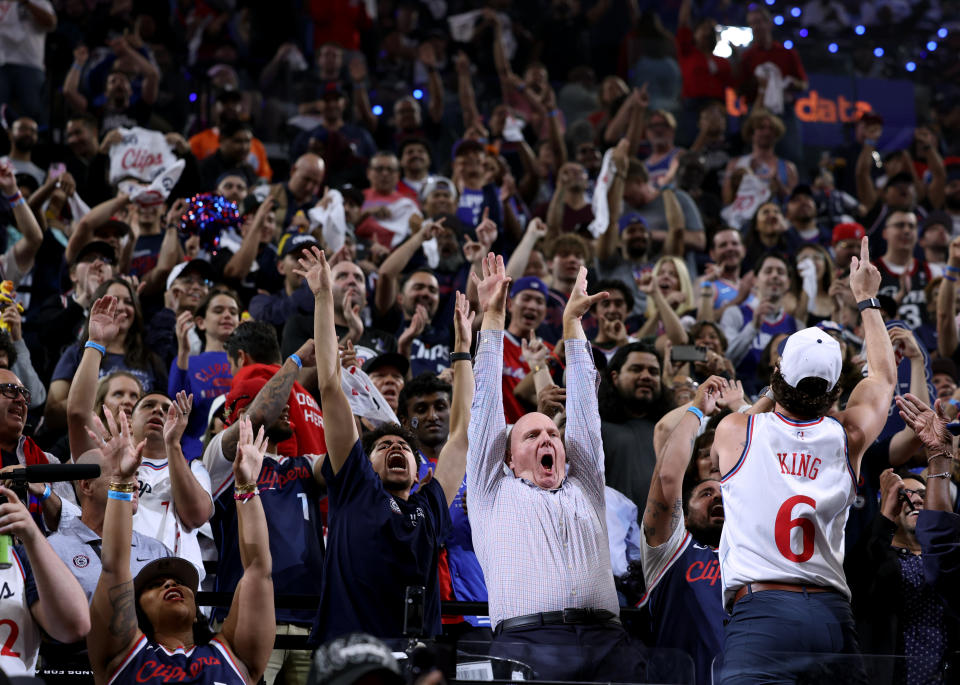 Ballmer applauds with fans in 