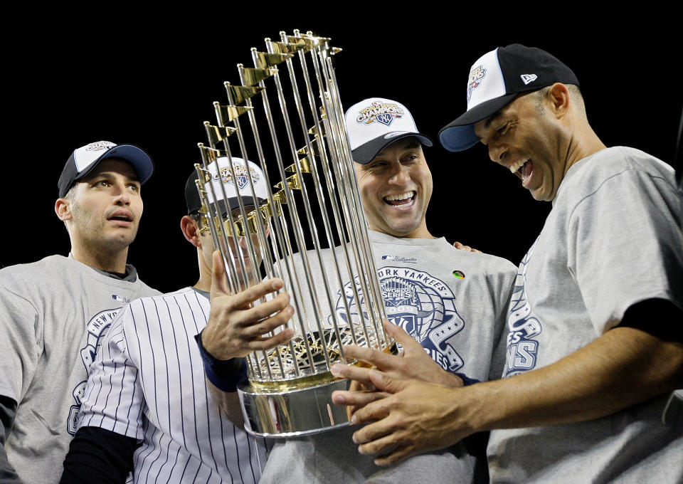 Andy Pettitte, Jorge Posada, Derek Jeter and Mariano Rivera celebrate after winning the 2009 World Series. (Pool/Getty Images)