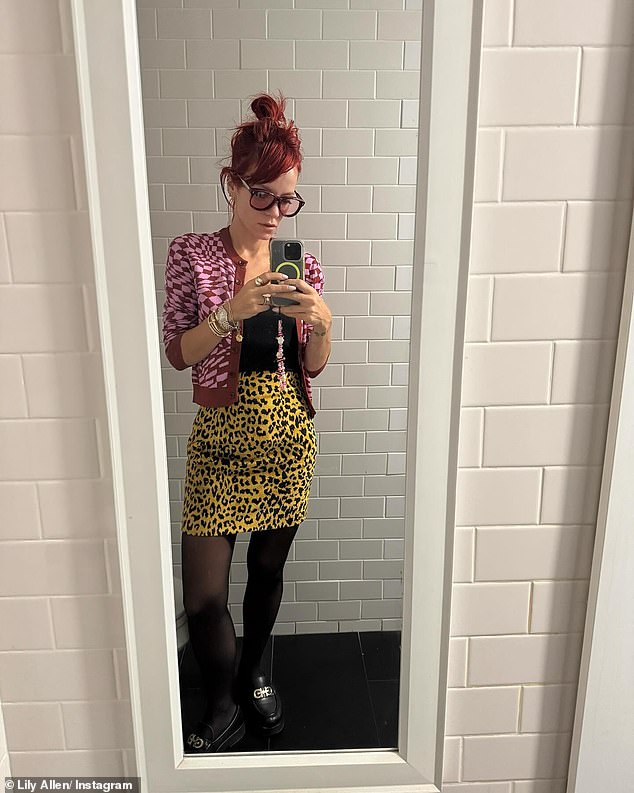 The Smile singer wore a striking outfit consisting of a pink and maroon geometric style cardigan over a black t-shirt and a bright yellow leopard print miniskirt.