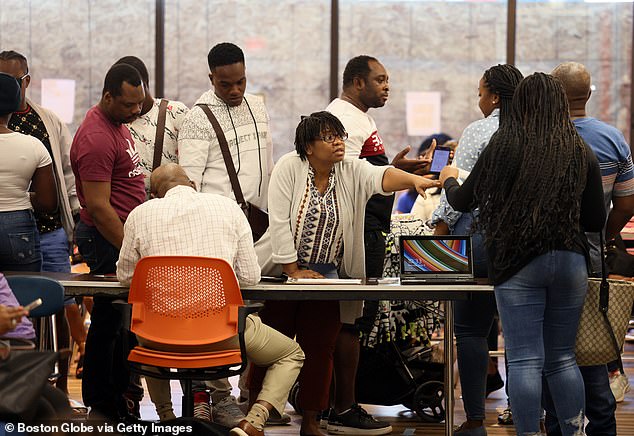 Haitian immigrants receive help from staff at the Immigrant Families Services Institute in Boston