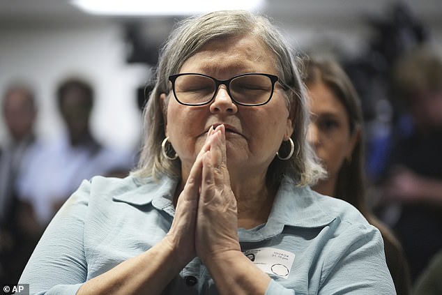 Diane, Kitty Hernandez's niece, put her hands to her face and closed her eyes before the announcement.