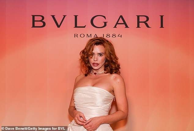 The actress, 42, showed off her incredible figure in a silky white corset dress, teamed with strappy silver heels.